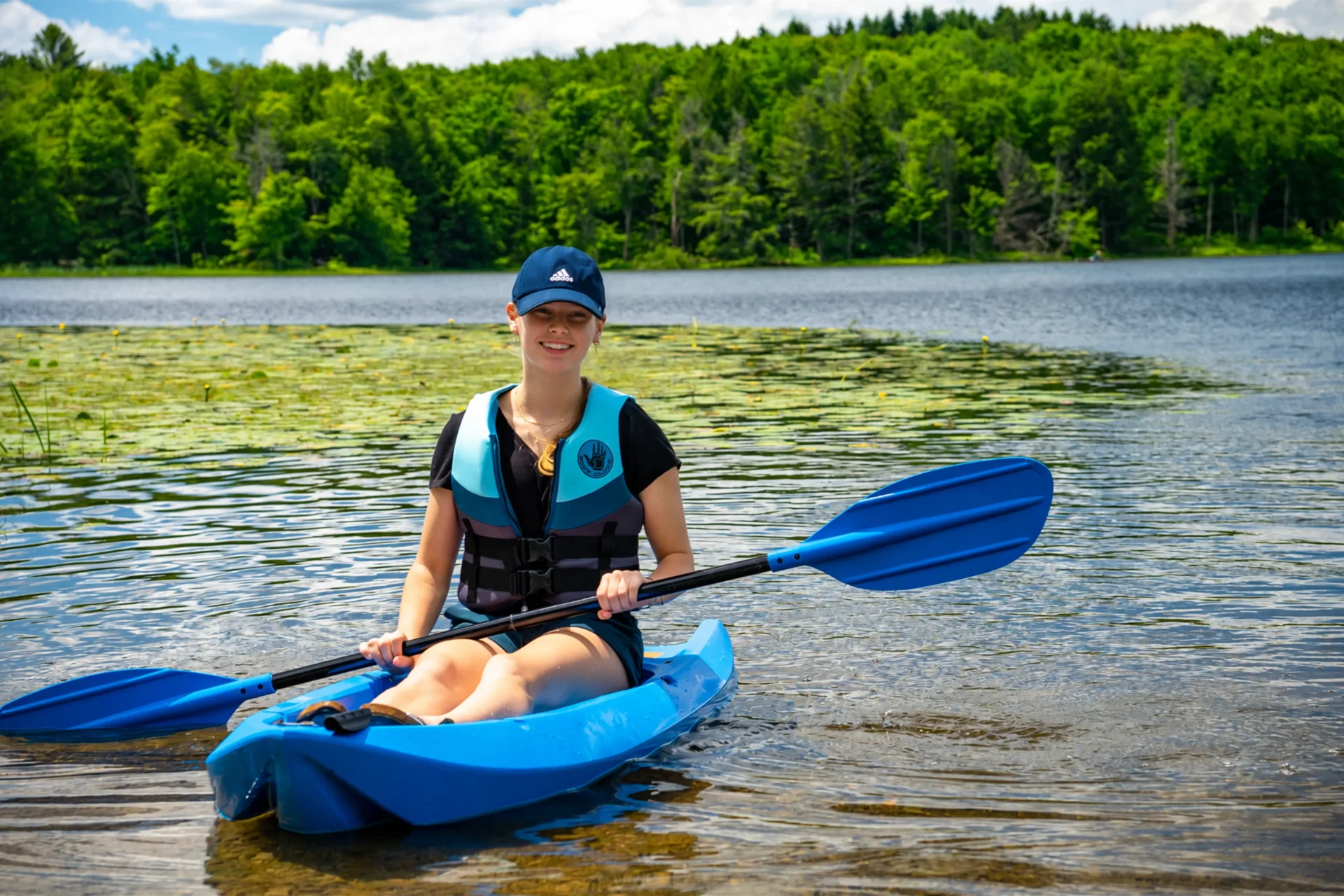 Woman kayaking on the water