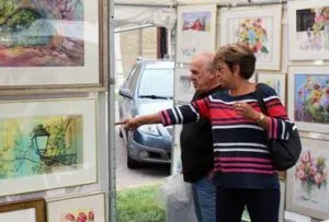 People looking at artwork at the Chenango Colorscape Arts Festival